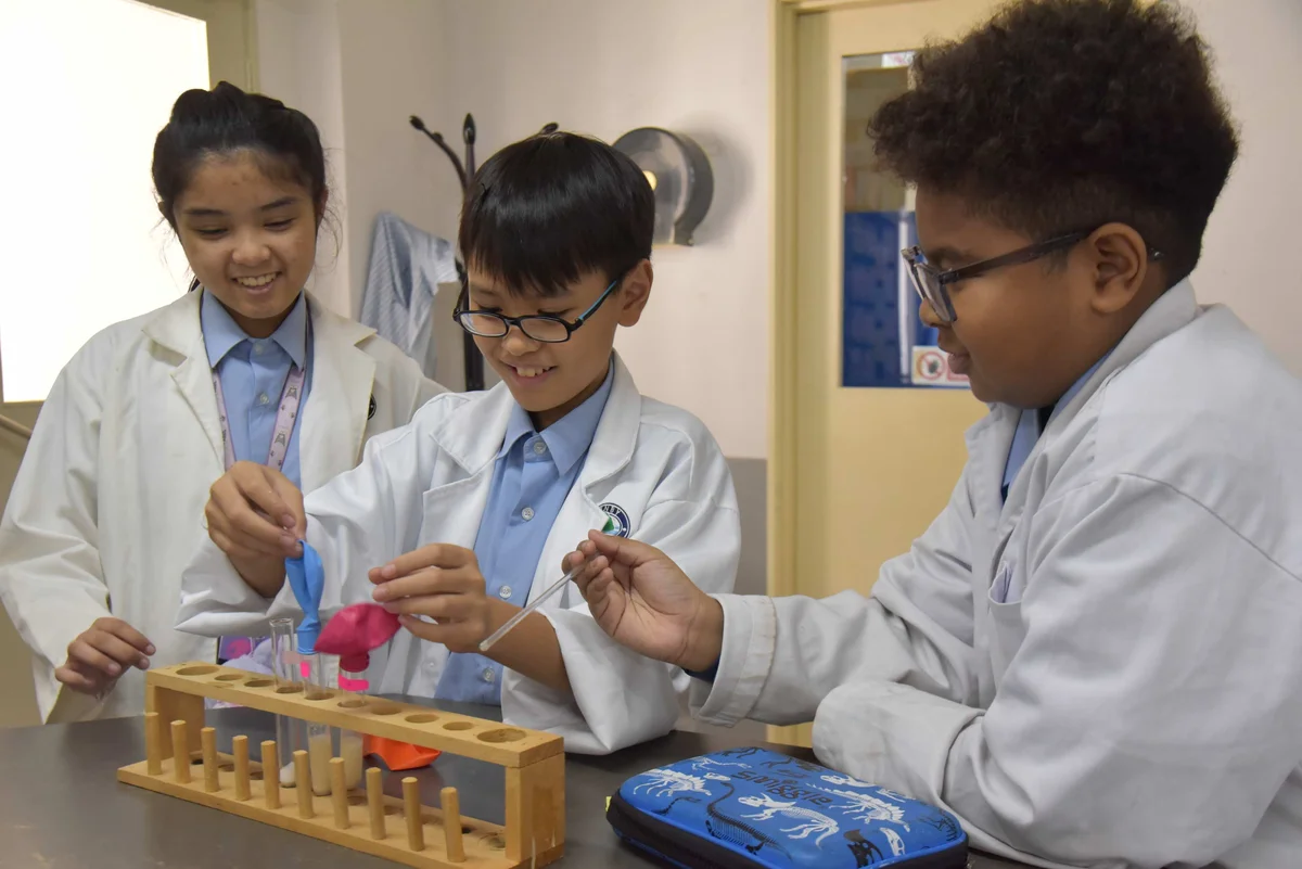Kids doing a lab experiment