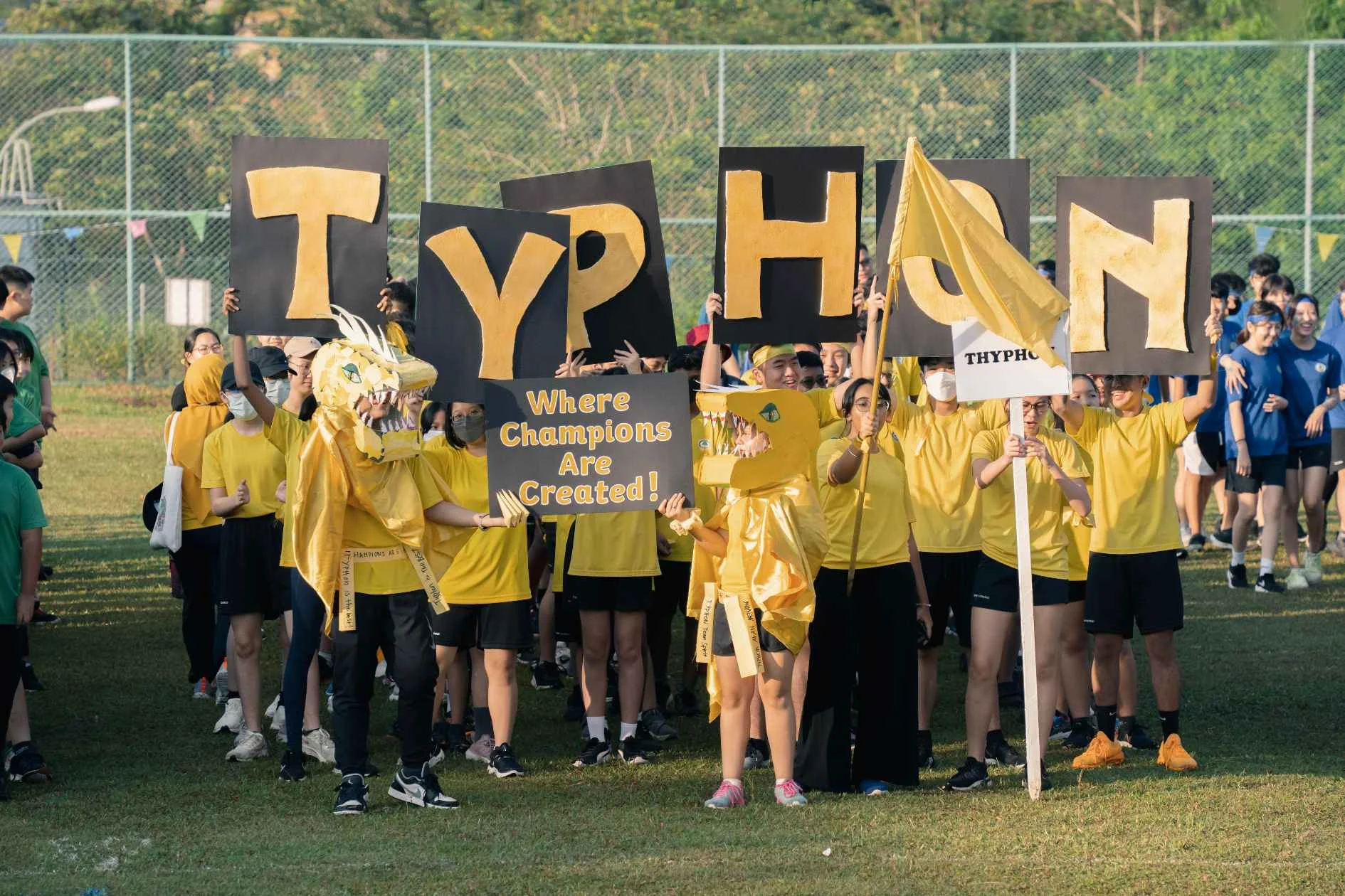 Students parading on a soccer field