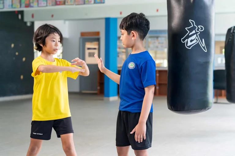 Teenagers practicing martial arts