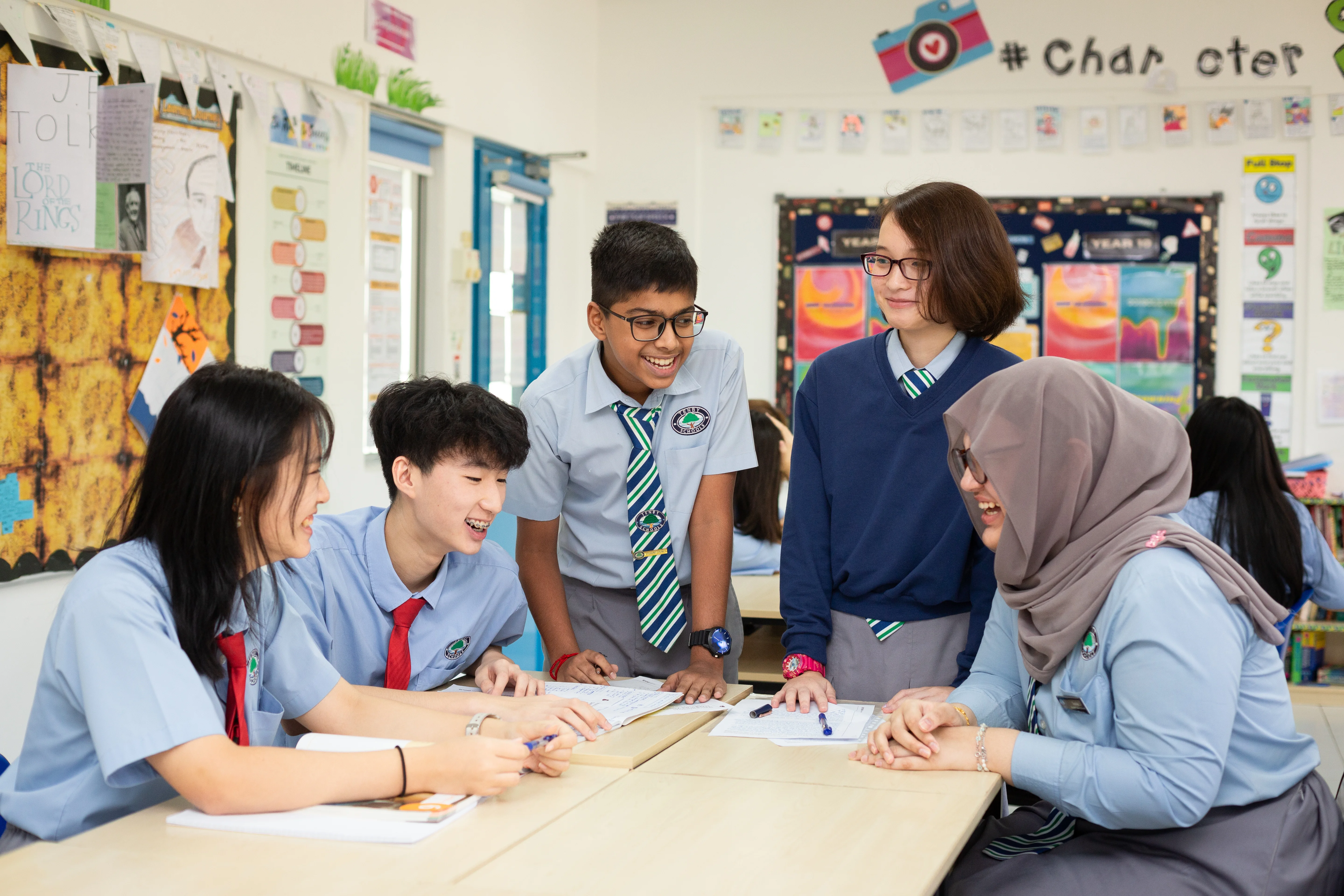 Students laughing together in a classroom