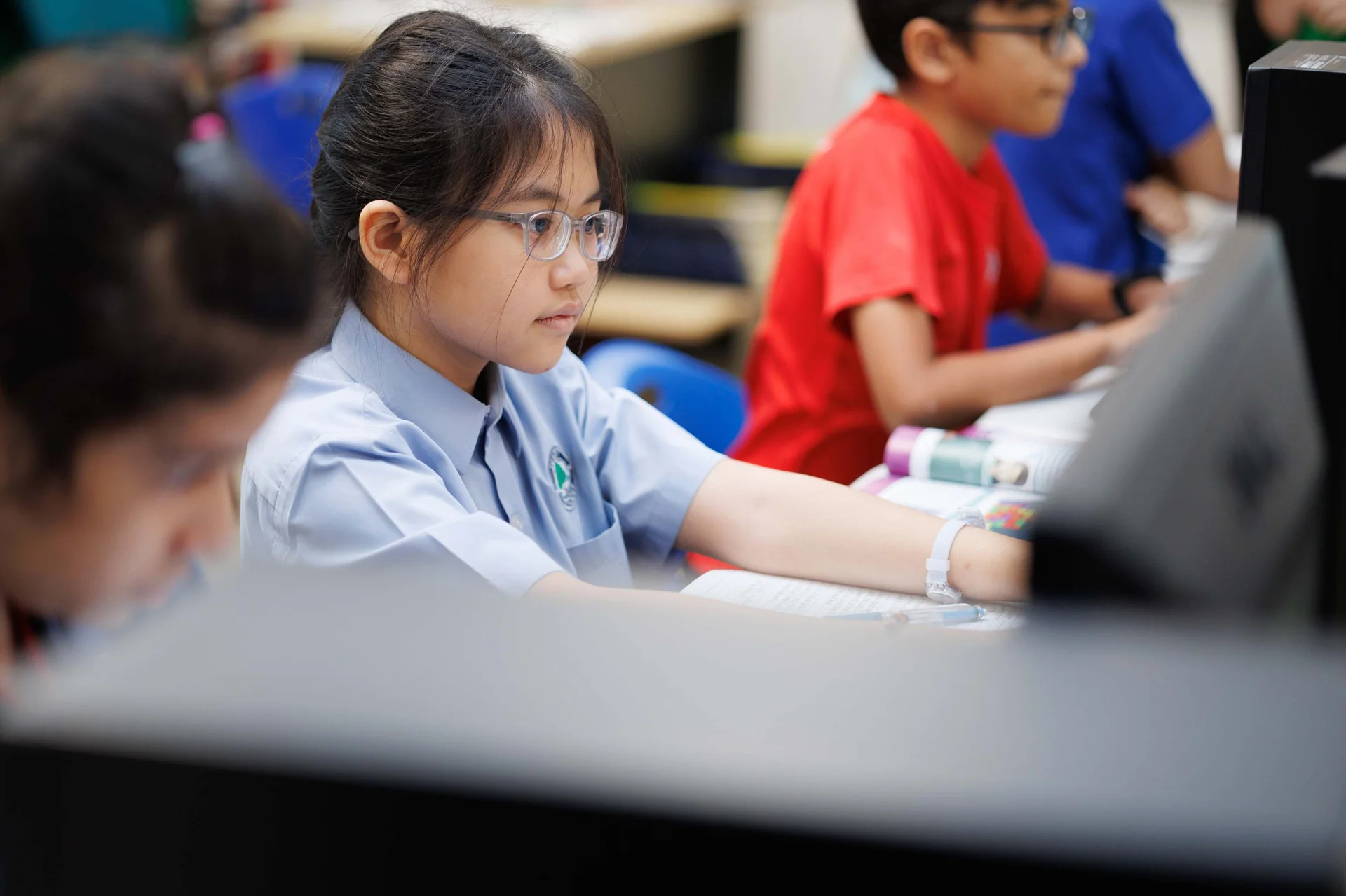 Young girl looking at a computer screen