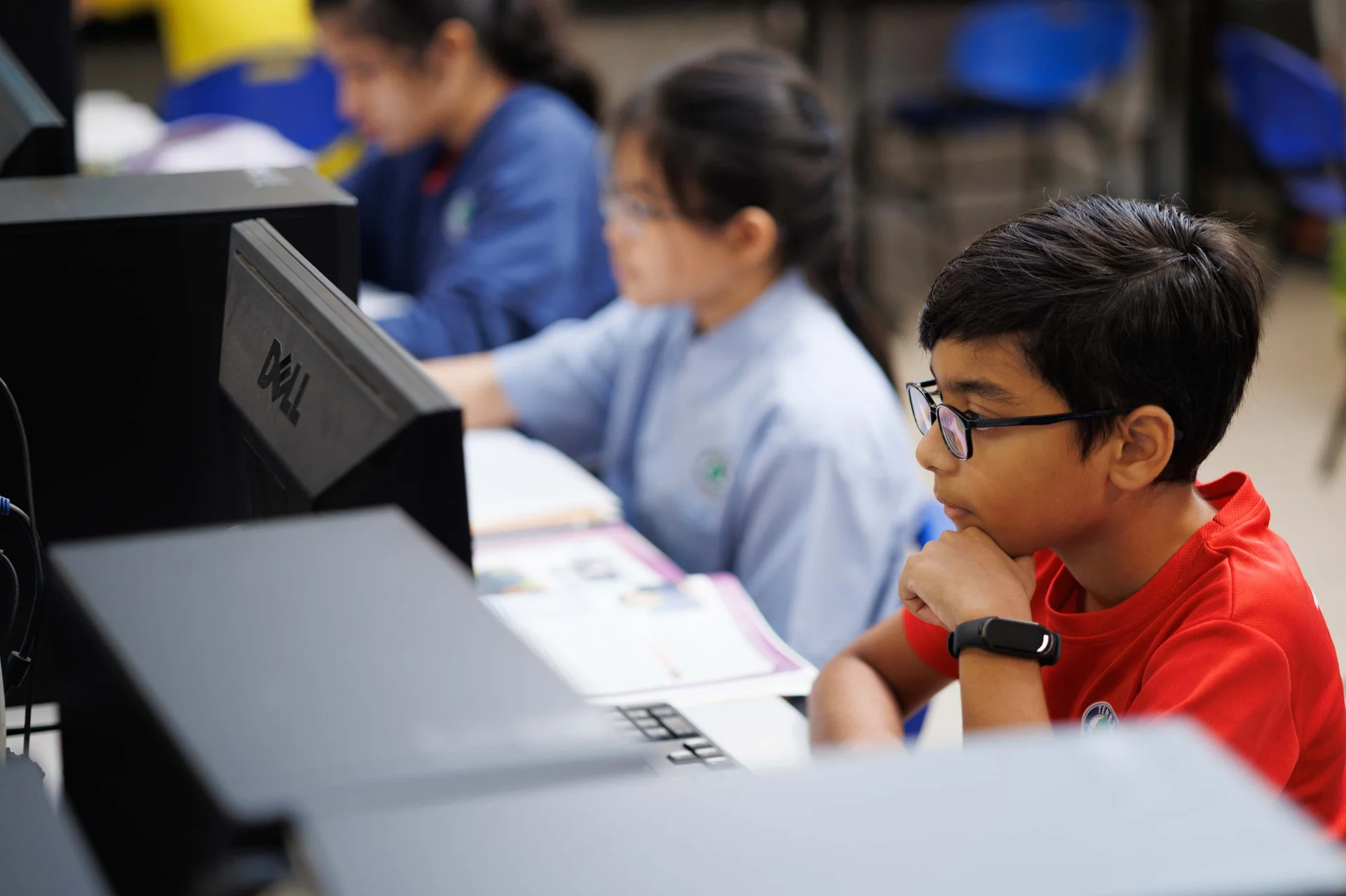 Young student looking at a computer screen