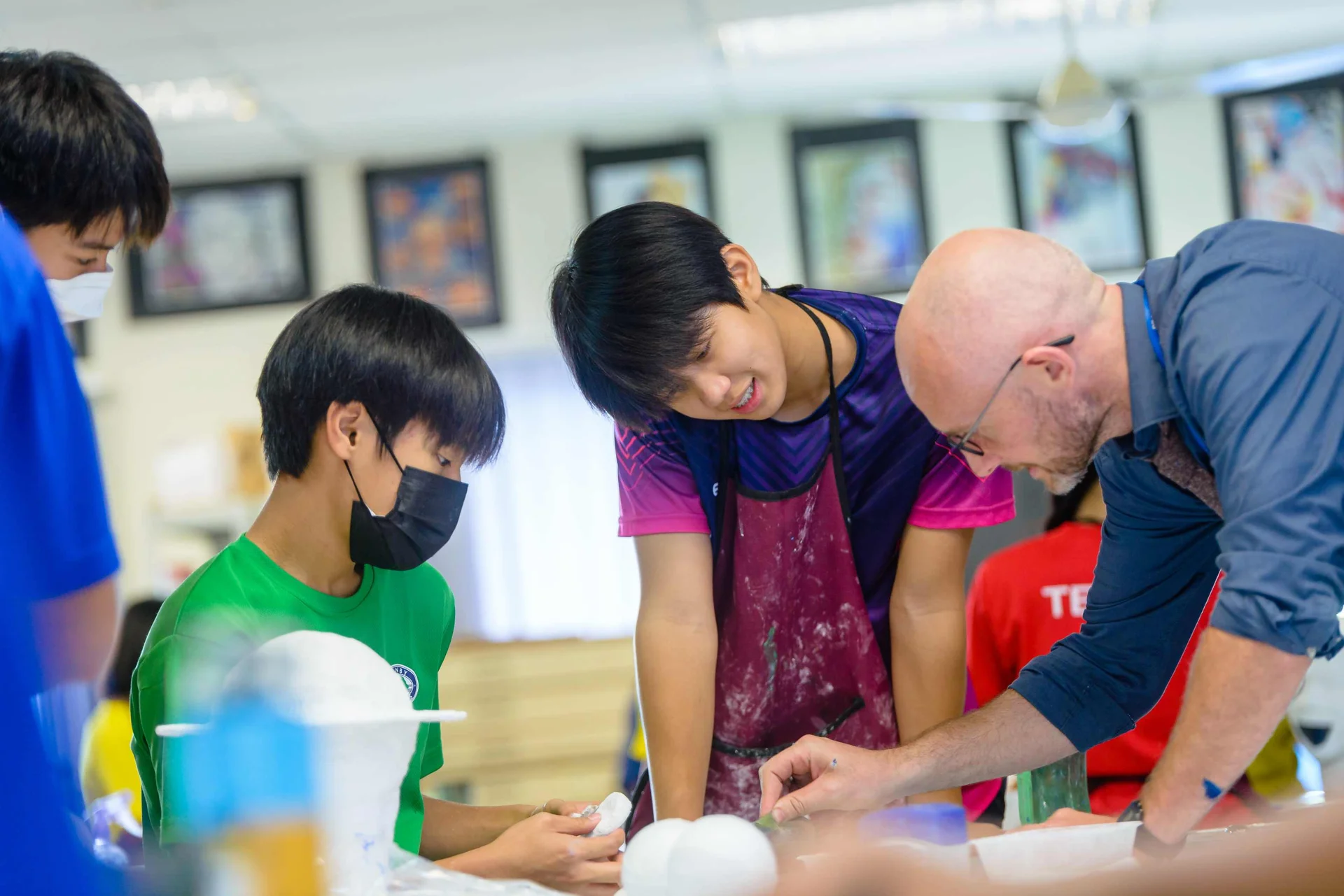 Teacher talking with his students
