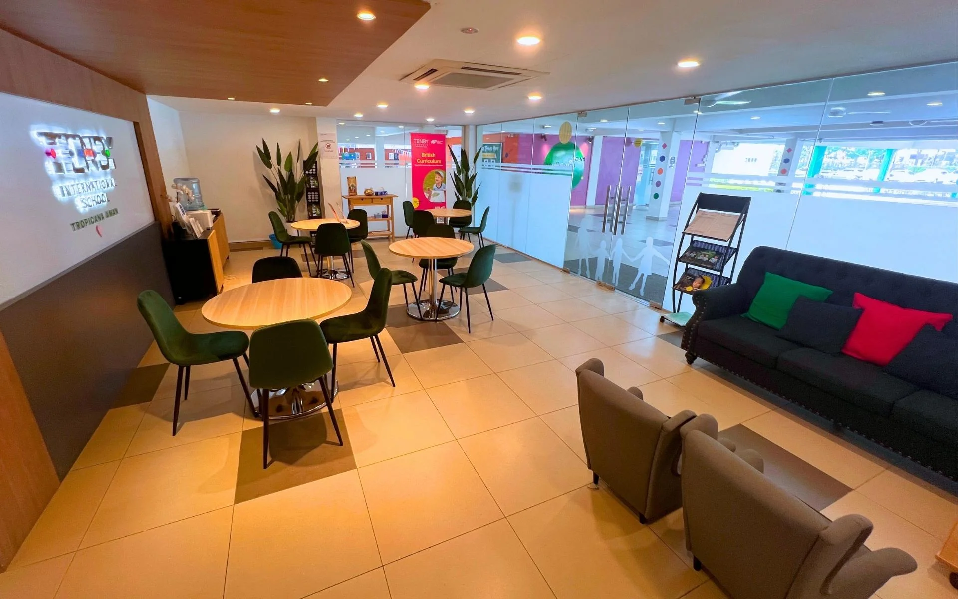 A welcoming Admissions area featuring a coffee corner and kids activity area for children. It offers families a relaxing space to learn more about our learning environment.